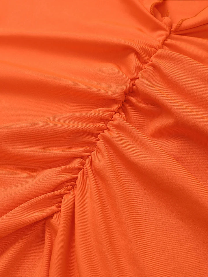 Alaia - oranje maxi jurk met ruches