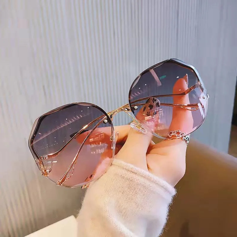 Wendy - metalen gebogen randloze zonnebril